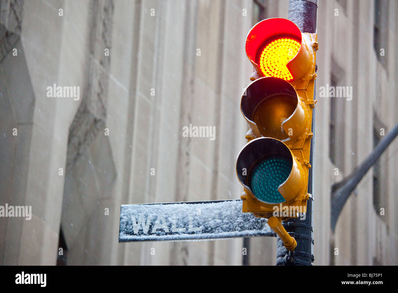 Wall Street Sign in a snow storm in New York City Stock Photo