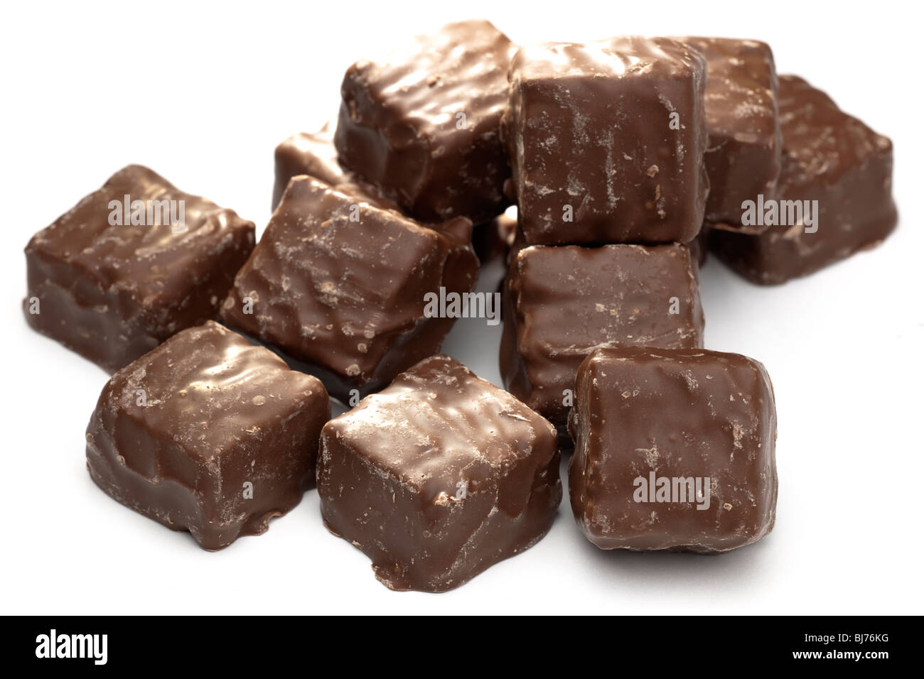 Pile of chocolate covered square biscuits Stock Photo