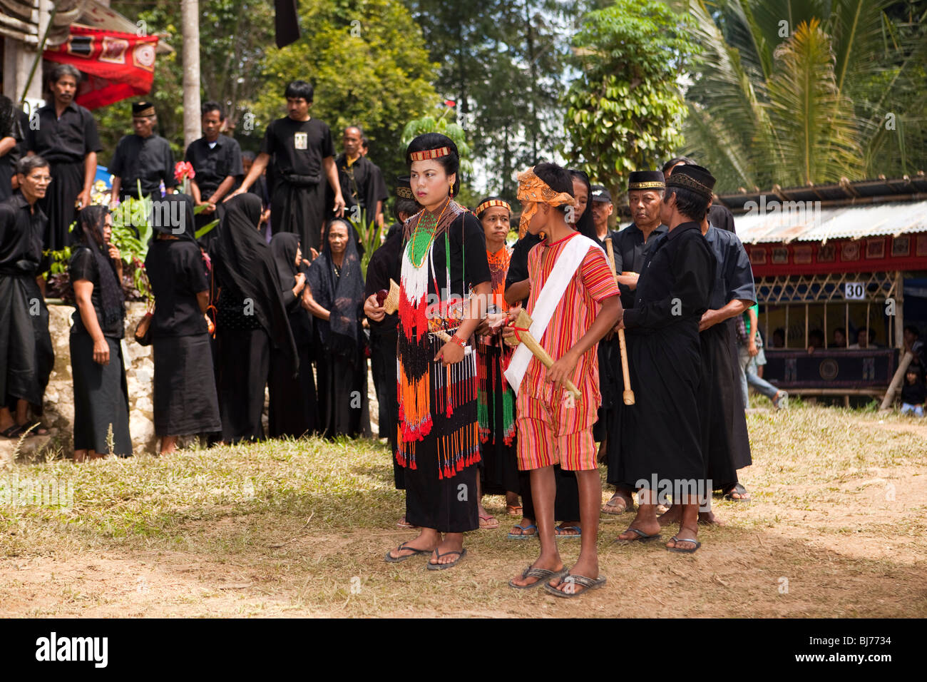 Indonesia, Sulawesi, Tana Toraja, Bebo, Torajan funeral traditionally dressed family mourners processing Stock Photo