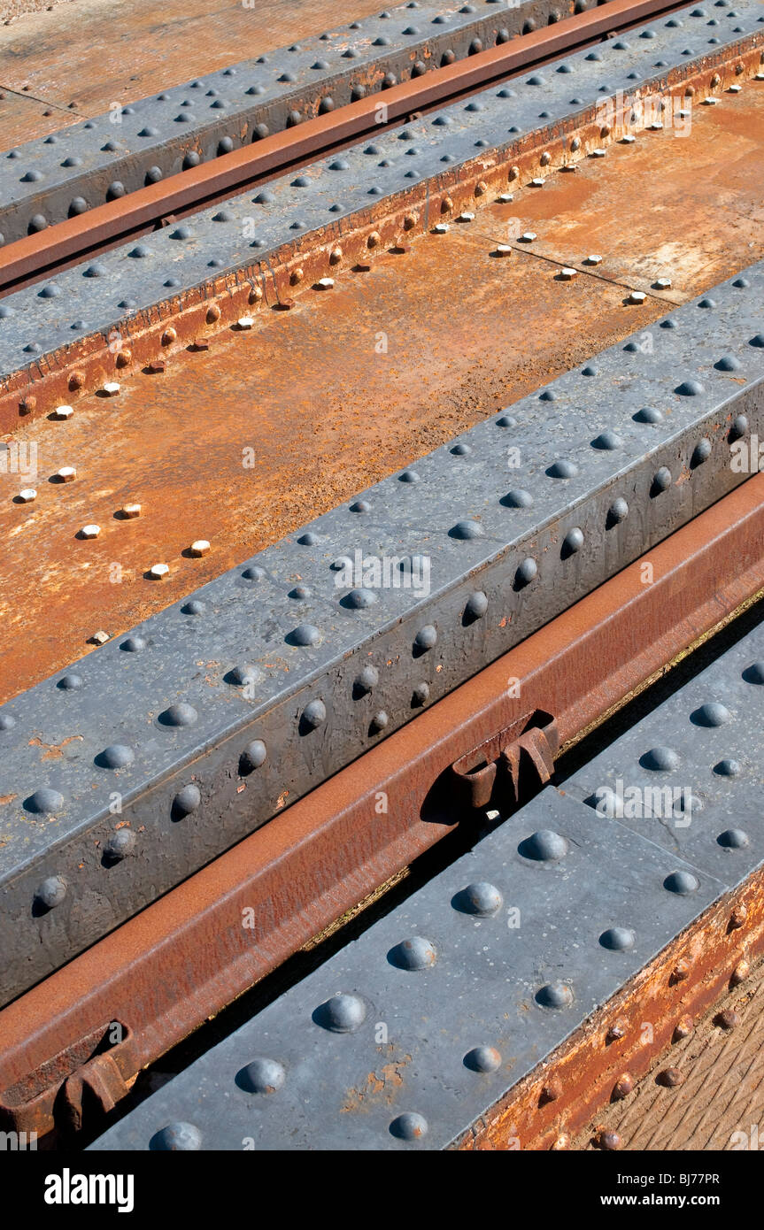 Rusty girders on steel railway bridge - France. Stock Photo