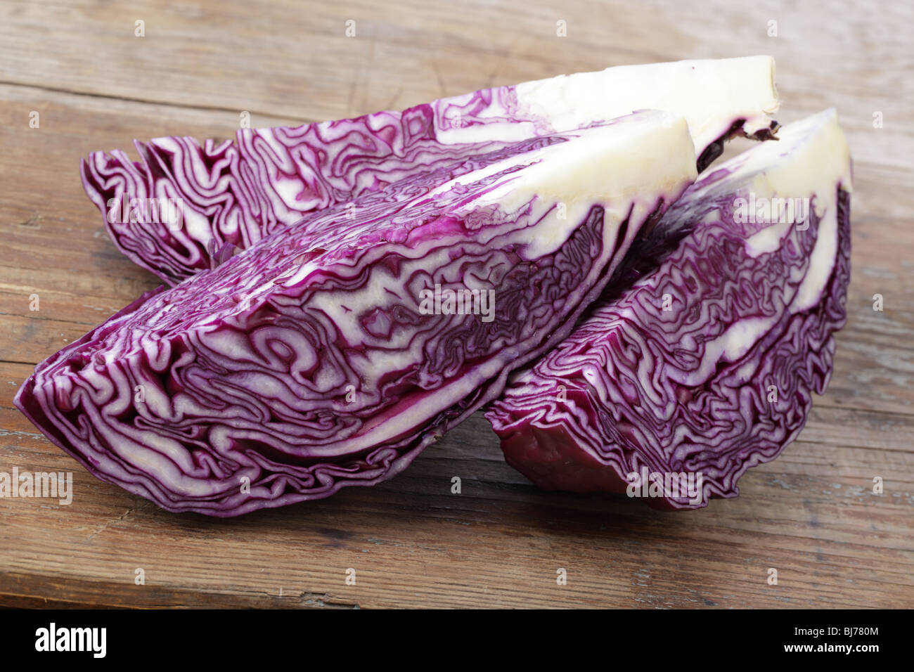 Sliced red cabbage on a wooden table Stock Photo