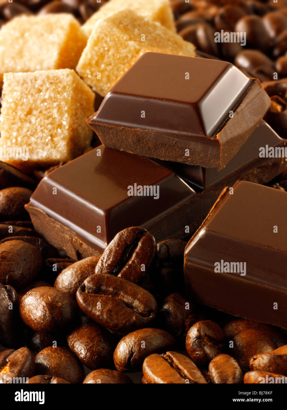 Pieces of chocolate, coffee beans and sugar. Stock Photo Stock Photo