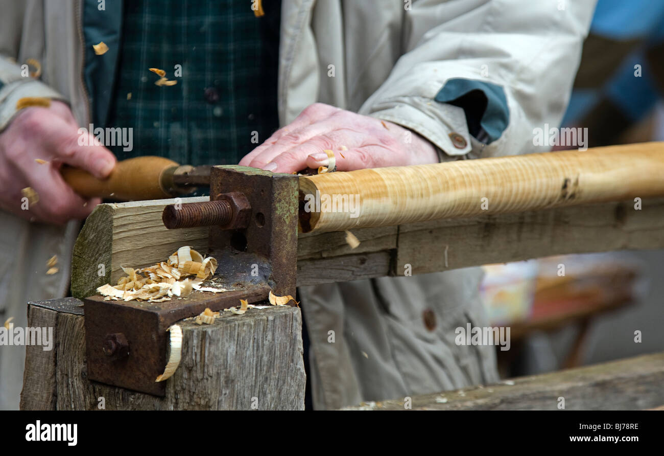 a man's hands working a lathe and woodworking Stock Photo