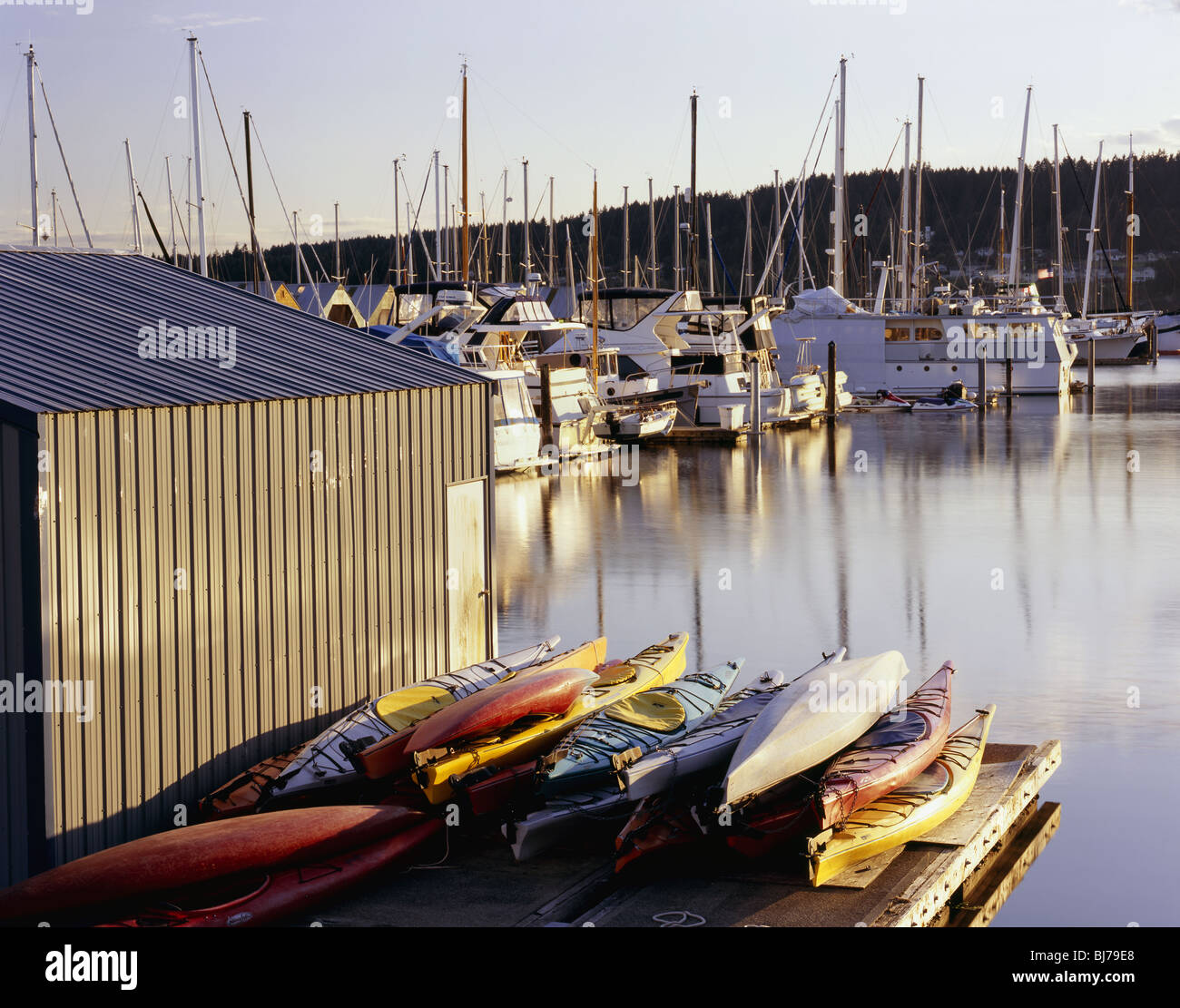 WASHINGTON - Kayaks on the boat dock at Liberty Bay on the Kitsap Peninsula in Poulsbo. Stock Photo
