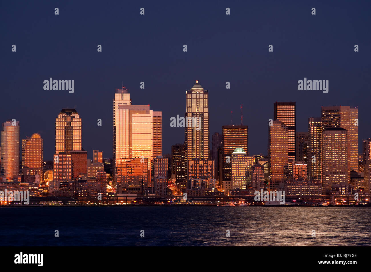 Retro image, Seattle Skyline from West Seattle with Elliott Bay and city lights Seattle Washington State USA Stock Photo
