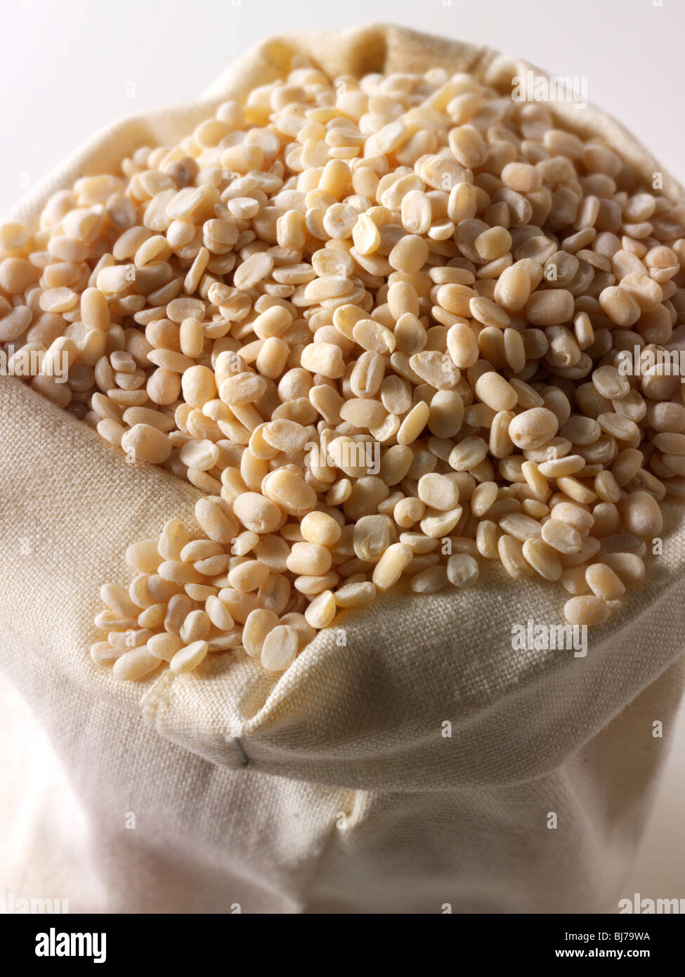 Whole dried urid dahl, urad dal, udad dal, urd bean, urd, urid, white lentil - close up in a bag Stock Photo