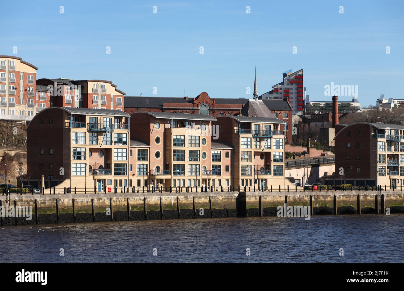 River side development on the north bank of the river Tyne at Newcastle, Byker Wall is visible in the background. Stock Photo