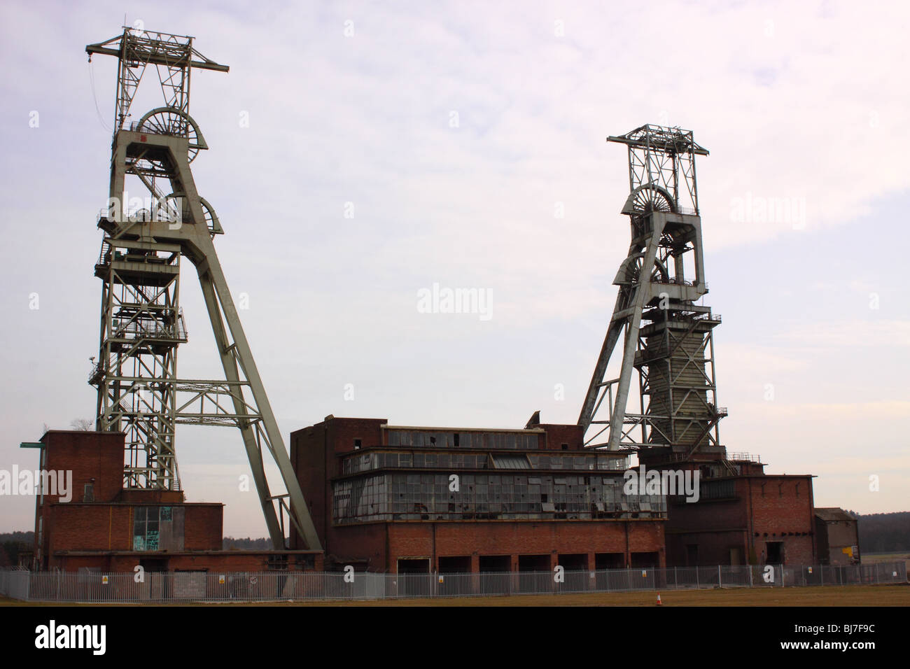 Clipstone colliery headstocks derelict and fenced to prevent trespass Stock Photo
