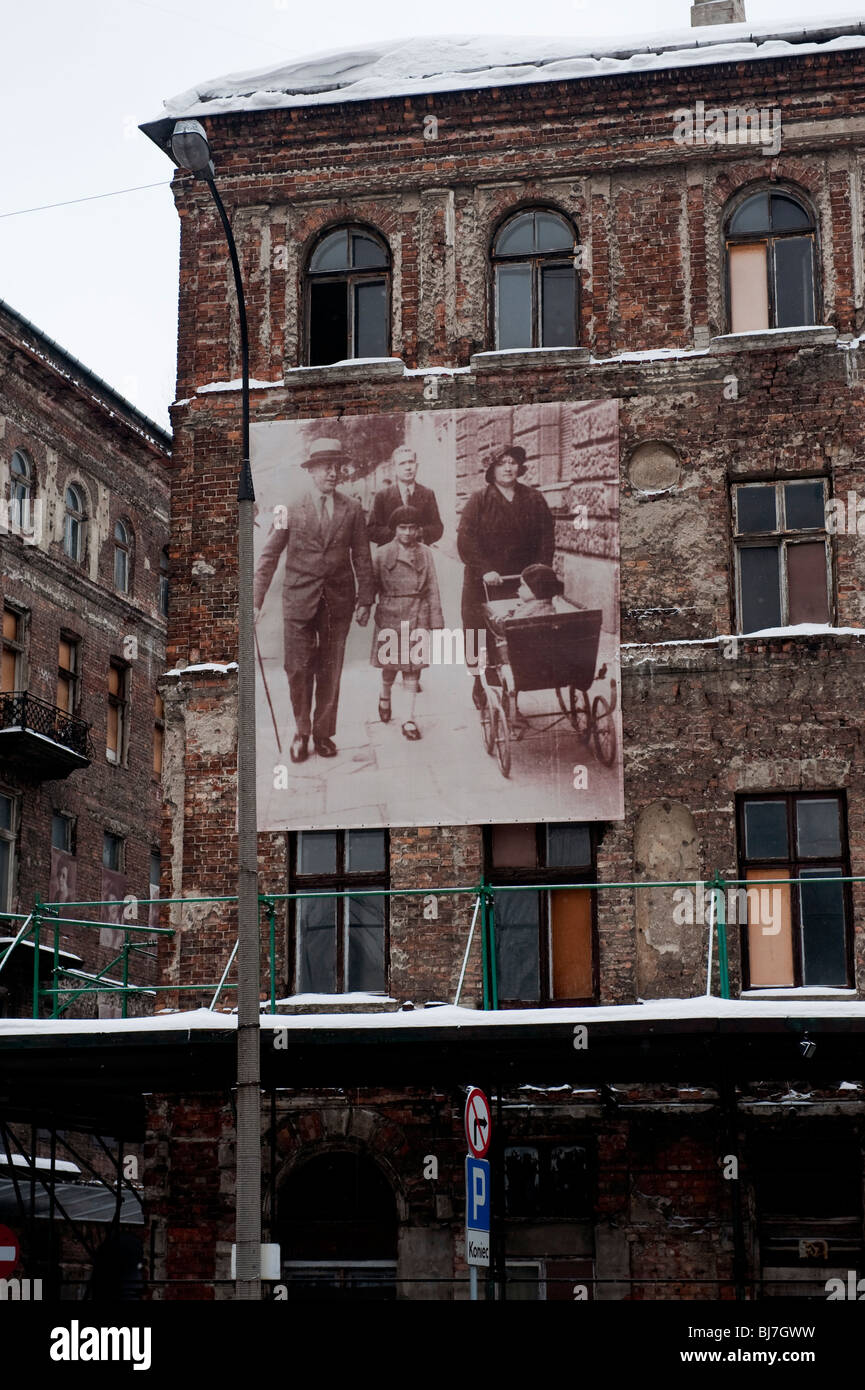 Old houses in Ulica Ul Prozna street part of the Warsaw Ghetto with pictures of  the Jewish people who once lived there Stock Photo