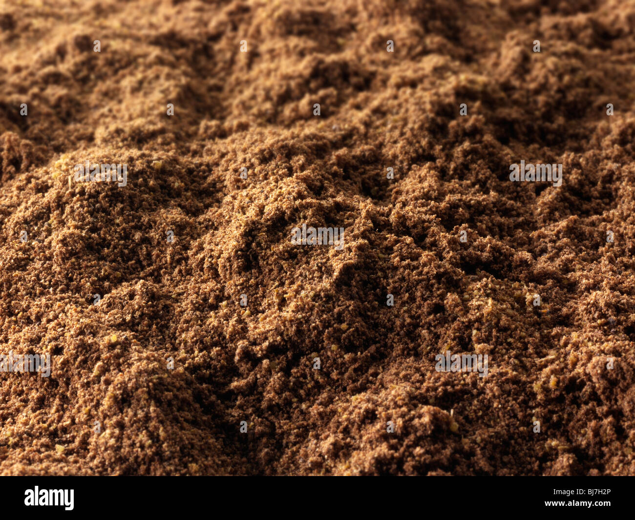 Ground Alspice powder , close up full frame Stock Photo