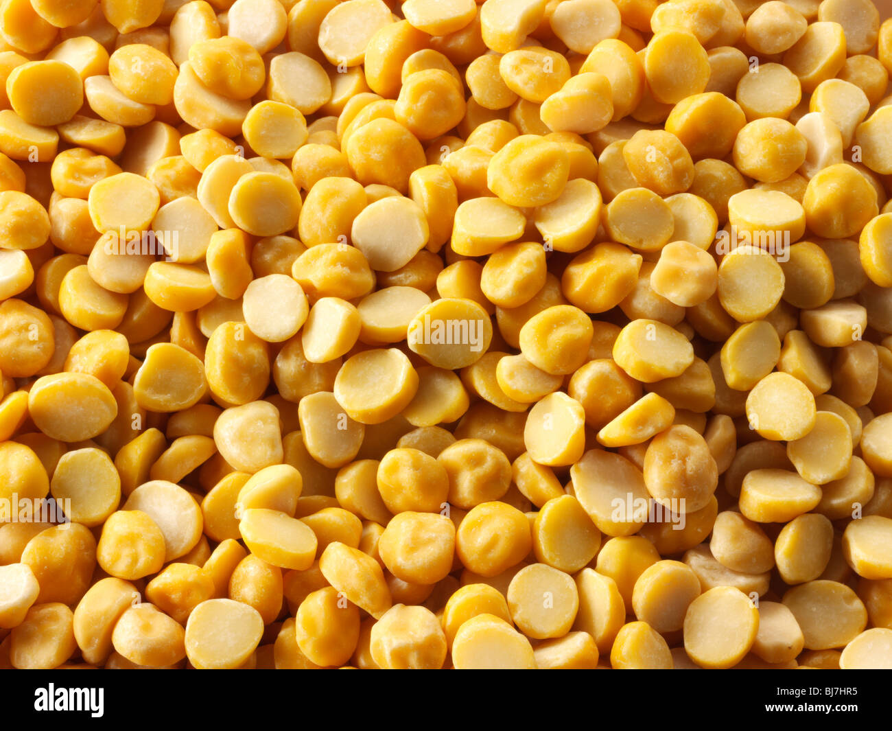 Whole dried chana dah yellow lentil beans - close up full frame top shot Stock Photo
