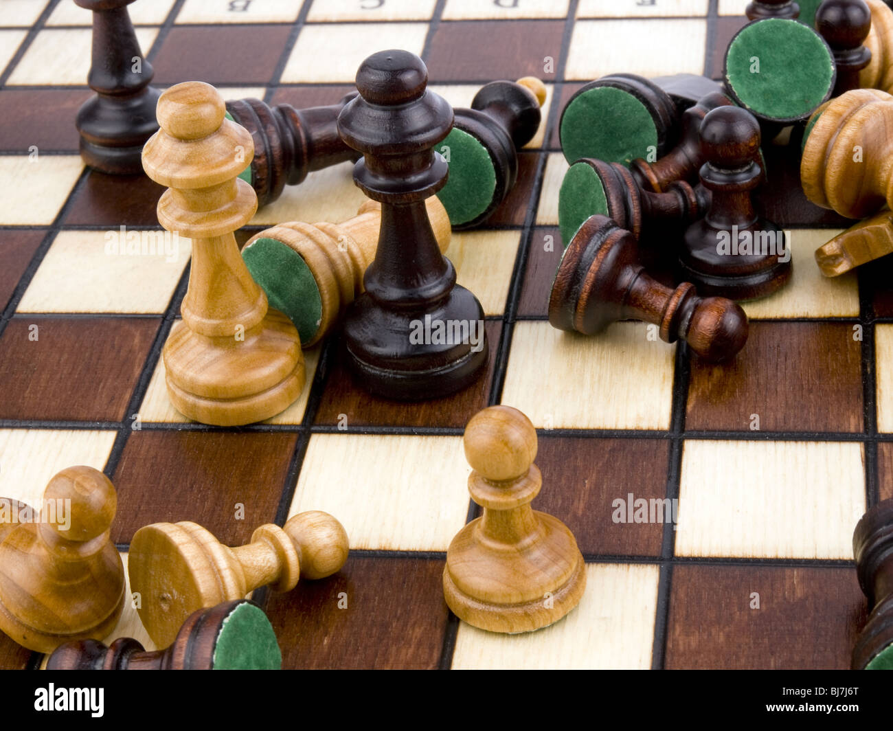 Closeup picture of wooden chess-men on chessboard. Stock Photo