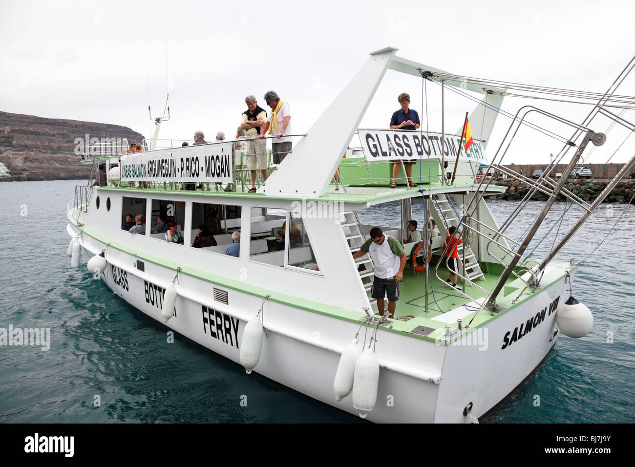 the glass bottom ferry leaving the marina of puerto de mogan gran canaria Stock Photo