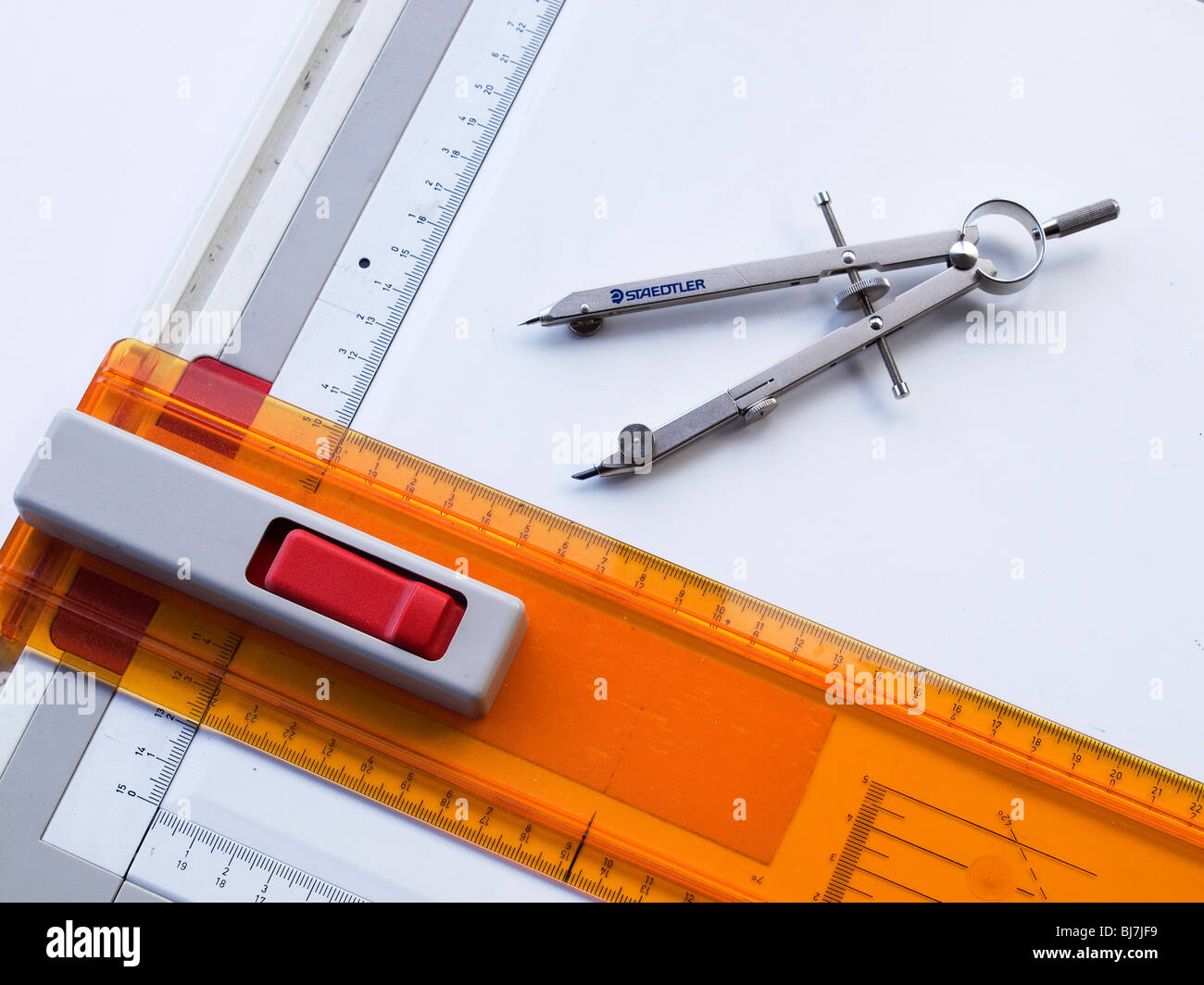 A technical drawing board and T-square with a pair of compasses Stock ...