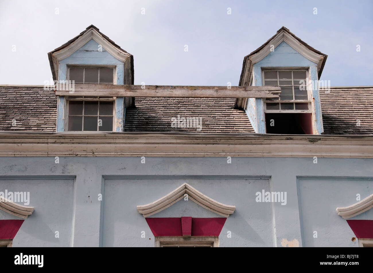 Two windows joined by a plank in Nassau, Bahamas. Hurricane protection Stock Photo Alamy