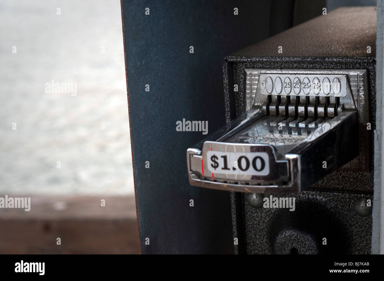 A quarter coin operating dispenser Stock Photo Alamy