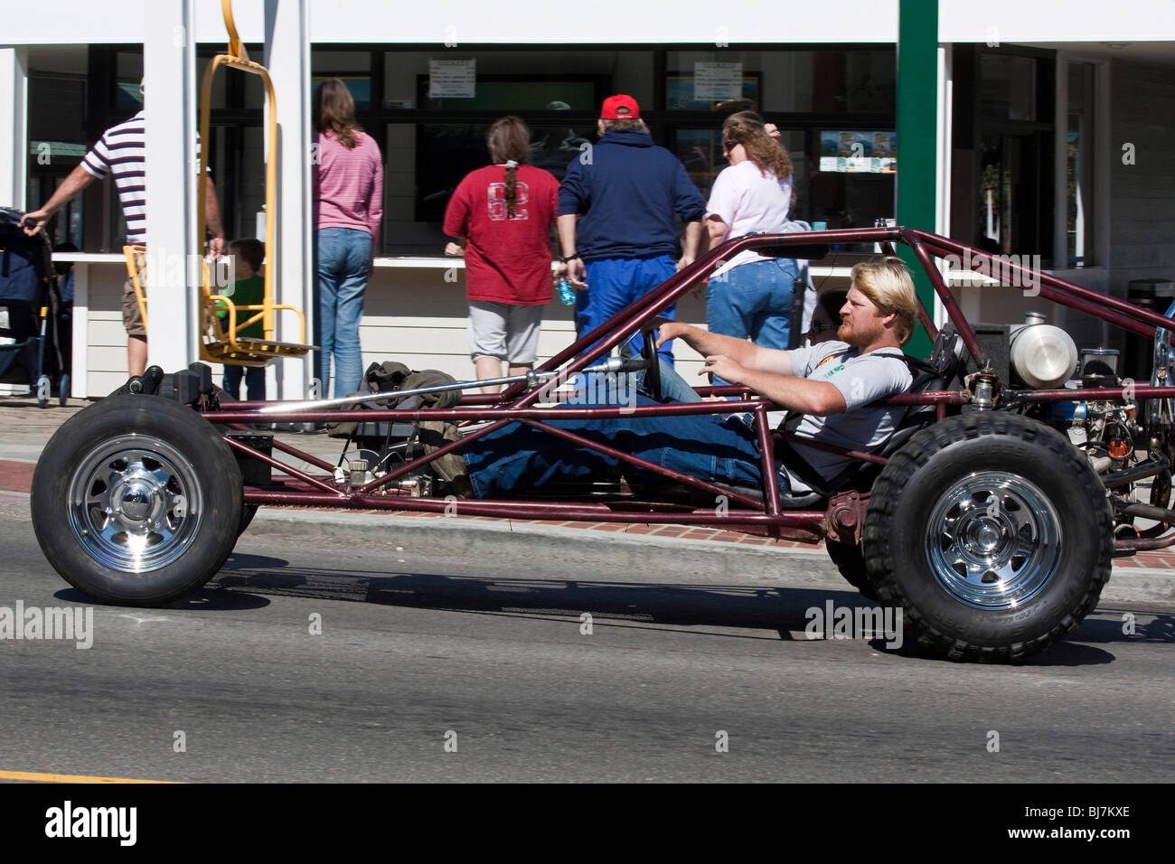 Innovation car with young man on road in center Gatlinburg Tennessee TN in USA city scene North America hi-res Stock Photo