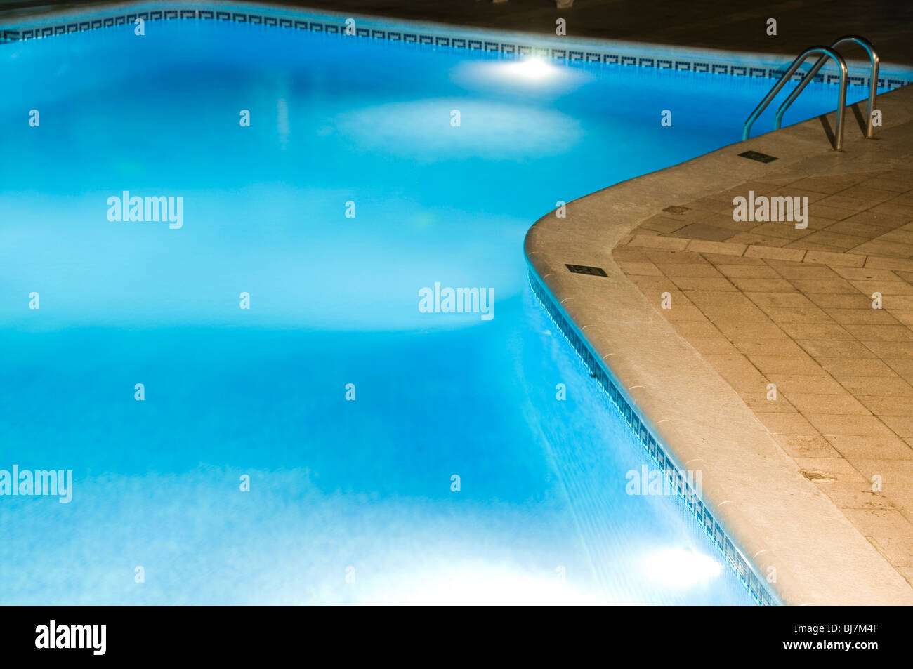 large hotel swimming pool at night with lights managua nicaragua Stock Photo