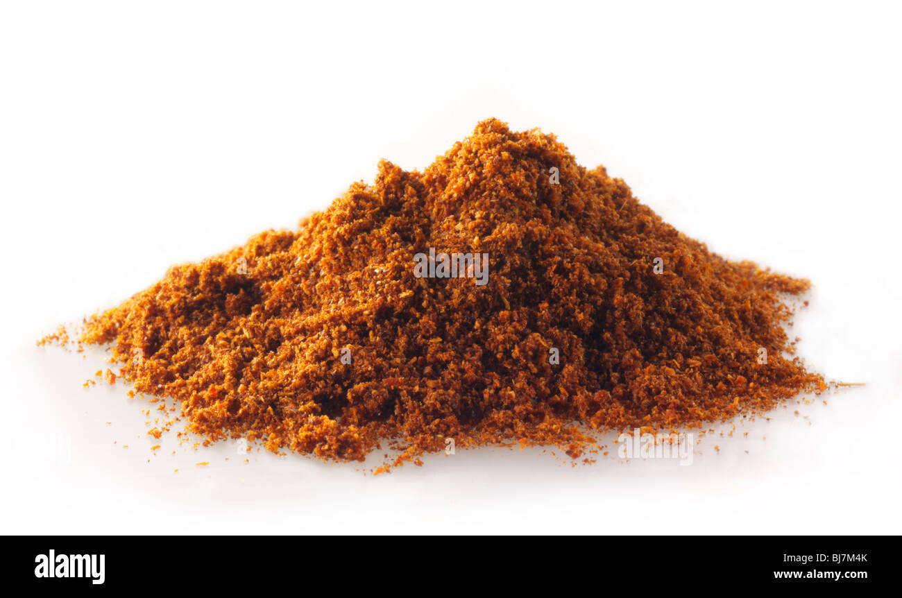 pile of Cayenne pepper powder  composed arrangement isolated against a white background Stock Photo