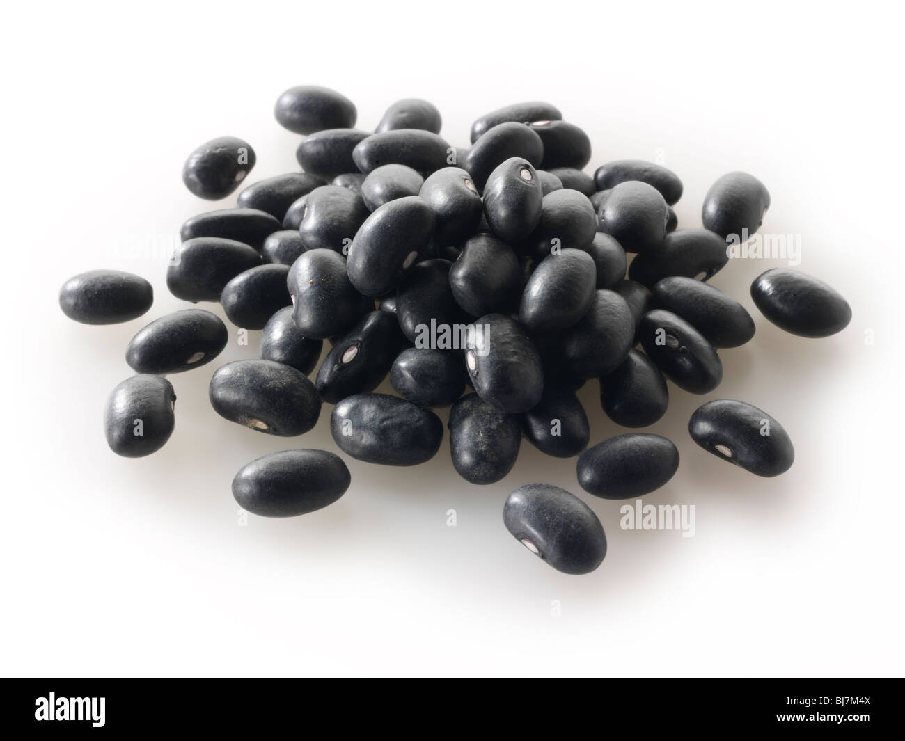 Whole dried black beans - close up full frame top shot. Stock Photo