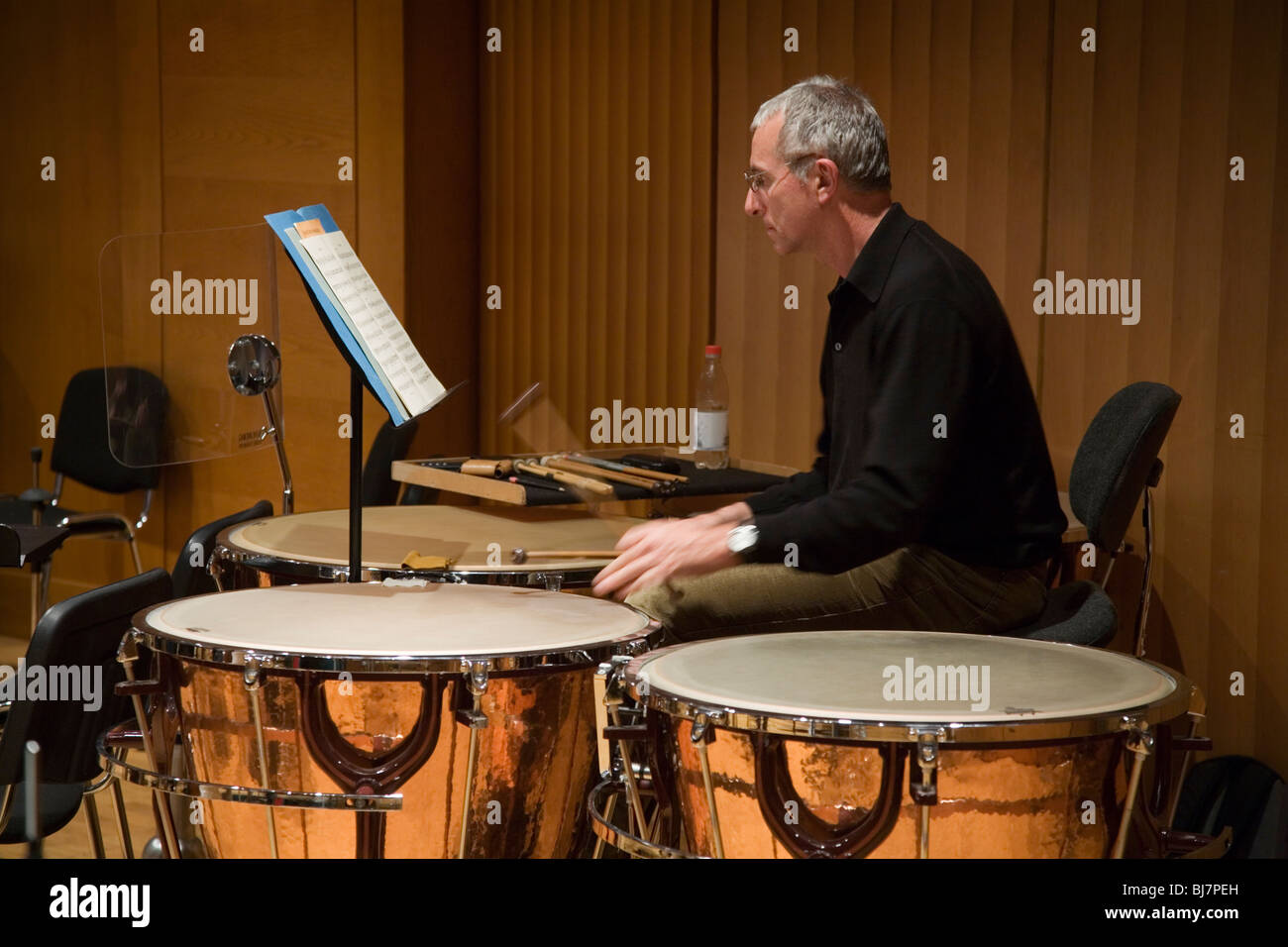 Timpani player in an orchestra rehearsal practice Stock Photo Alamy