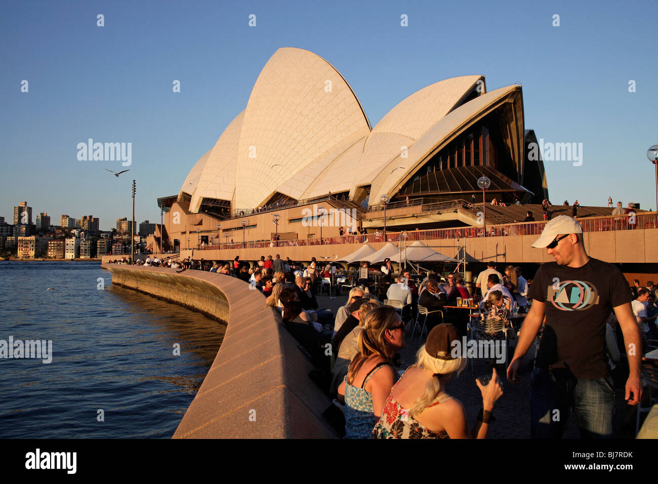 Opera Bar customers in front of the famous opera in Sydney, New South Wales, Australia Stock Photo