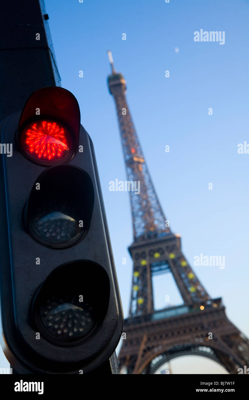 Red french traffic light / signal in Paris, with the Eiffel Tower behind. France. Stock Photo