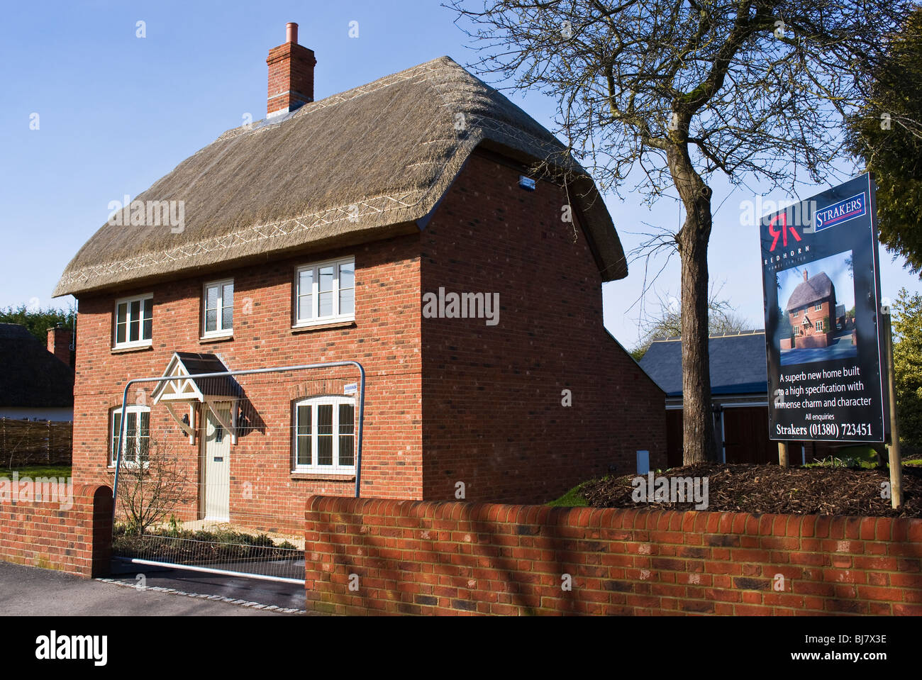 New thatched house For Sale in Urchfont village Wiltshire England UK EU viewed from public highway Stock Photo