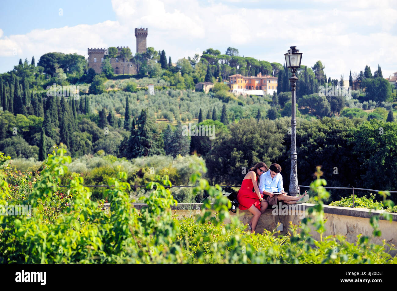 Florence, Tuscany, Italy. South from the upper terrace or Knight's Garden of the Boboli Gardens. Tourist couple read guide book Stock Photo