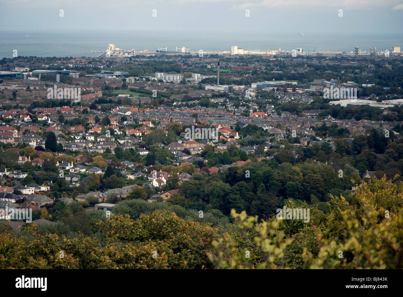 View of Edinburgh looking north towards Leith Docks and the Forth Estuary from Corstorphine Hill Tower. Stock Photo