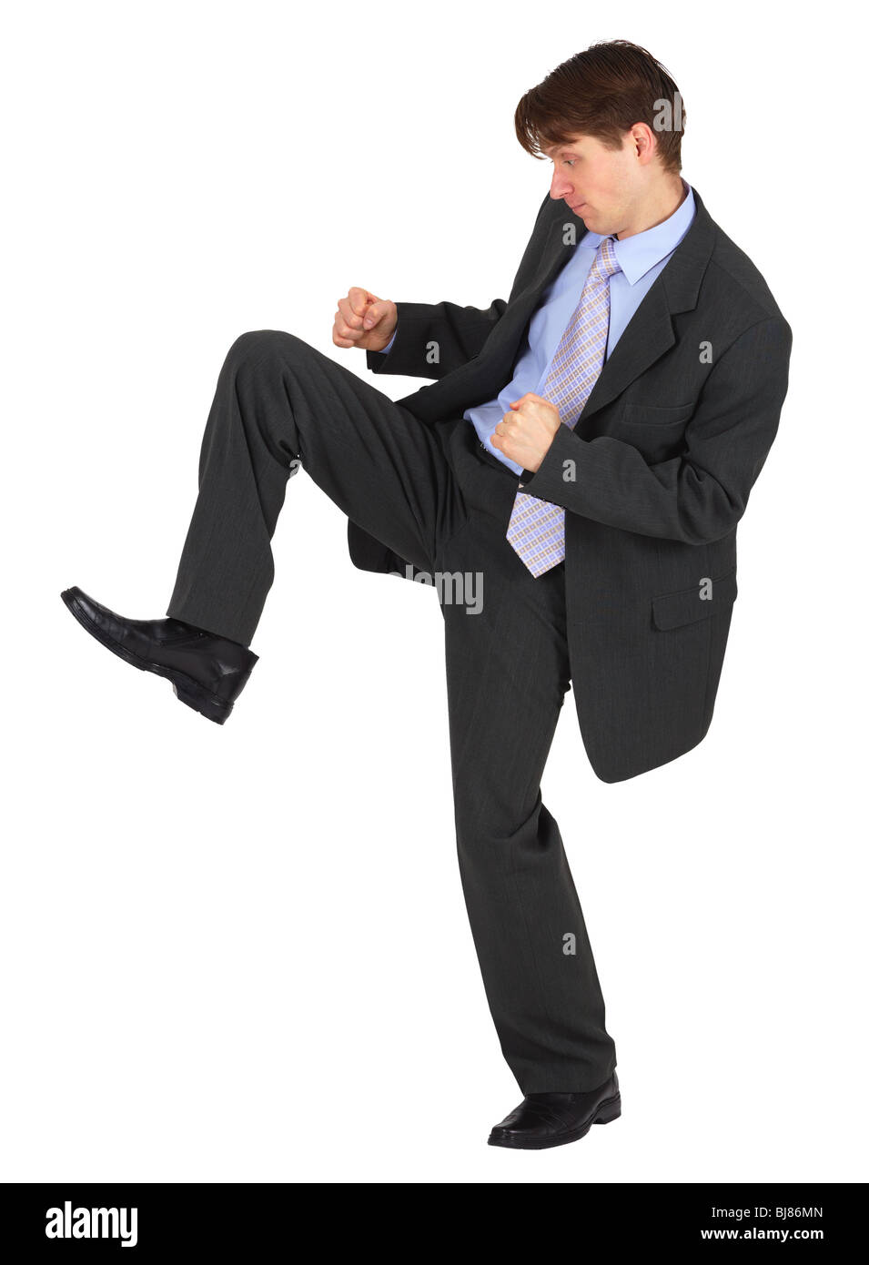 Businessman kicks down, isolated on white background Stock Photo Alamy