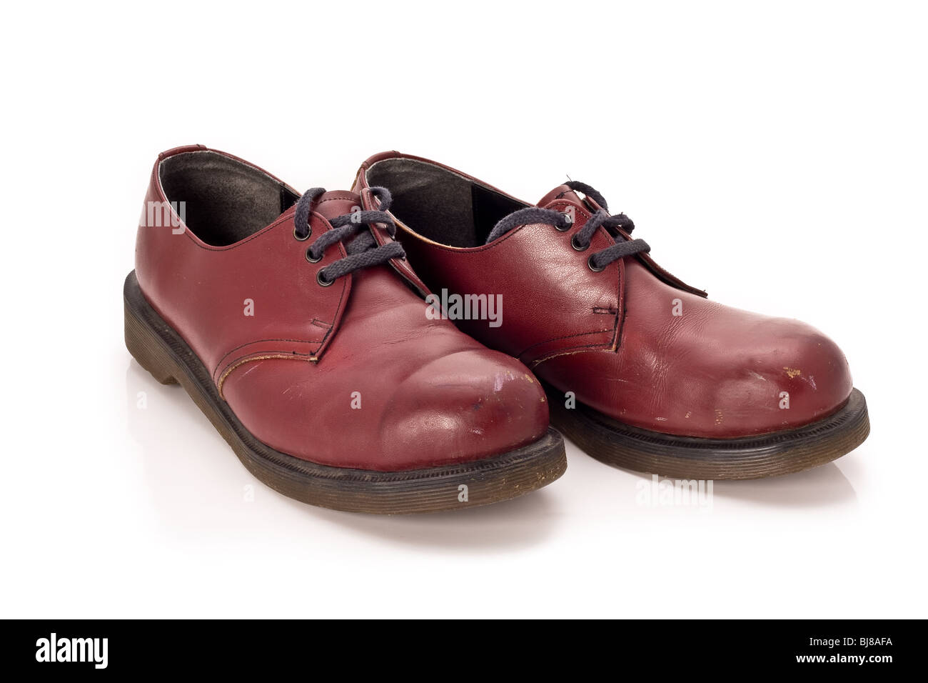 A pair of red shoes on white background Stock Photo - Alamy