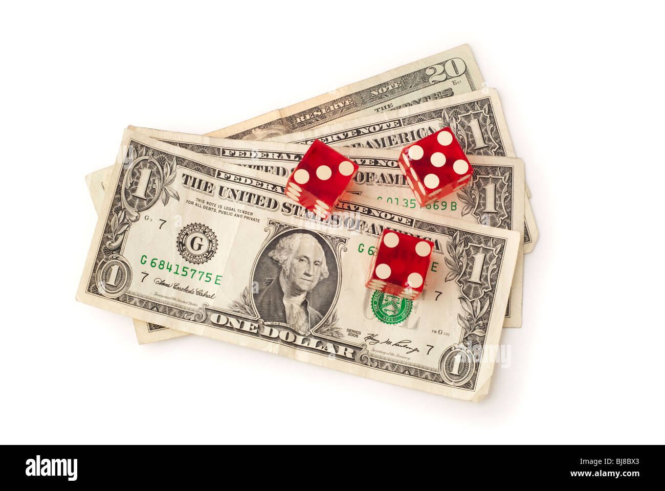 Three dice and some dollar bills shown from a straight overhead on white background. Saved with
