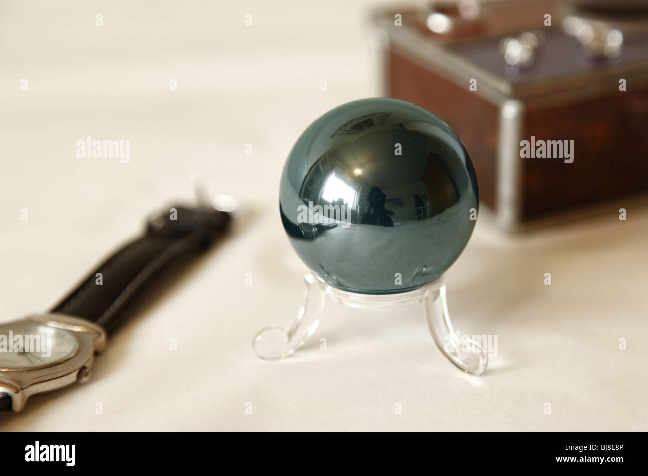 Hematite bloodstone ball sphere on a stand. Stock Photo