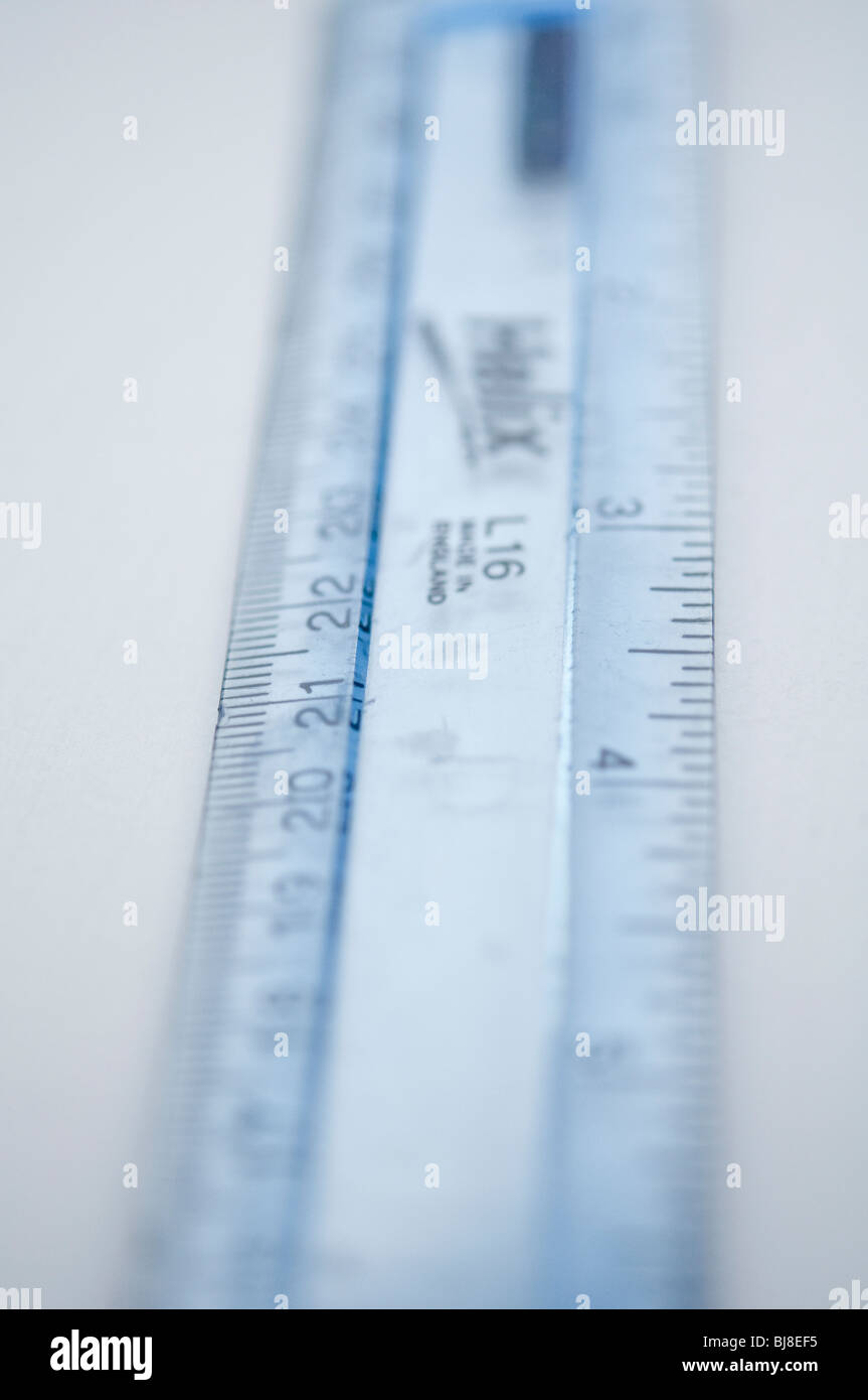 A plastic ruler, with extreme shallow depth of field, giving the ruler a soft and indistinct effect. Stock Photo