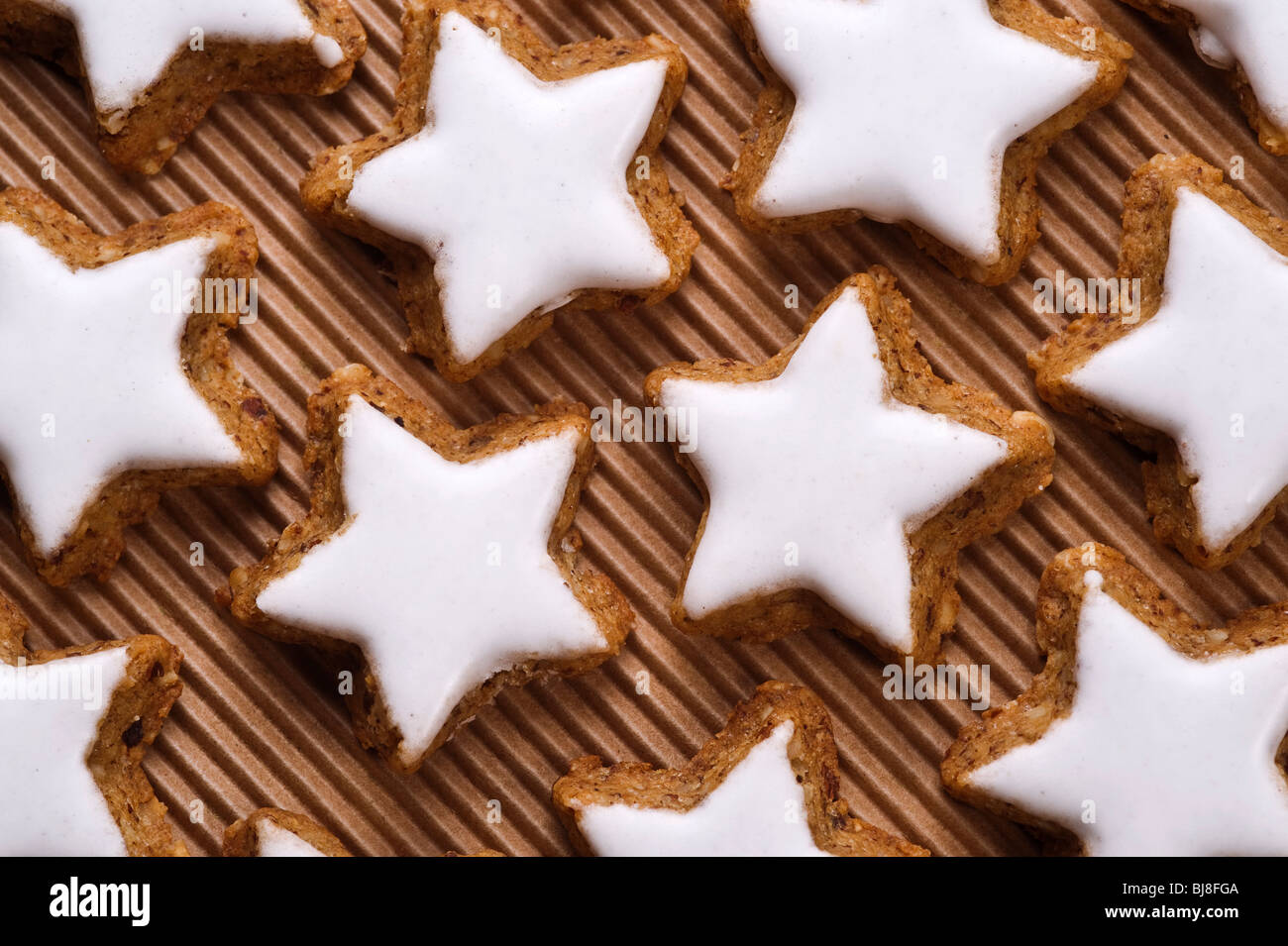 glazed nut star shaped cookies on paper background Stock Photo