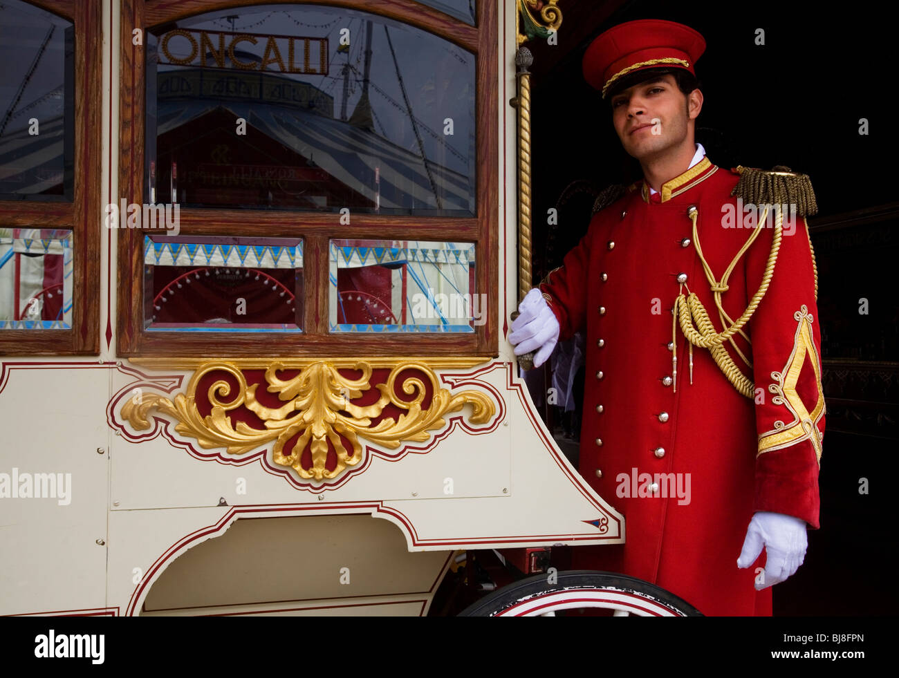 A Circus Usher in front of a Sugar Candy Machine. Circus Roncalli. Munich, Germany Stock Photo