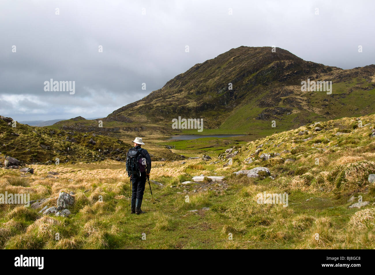 A walker on old track in the Kenmare Uplands, County Kerry, Ireland