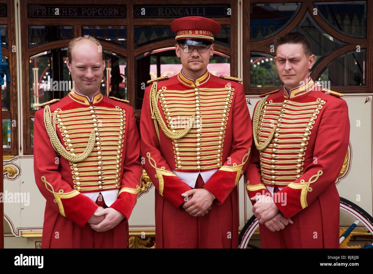 Portrait of three circus ushers. Circus Roncalli. Munich, Germany Stock Photo