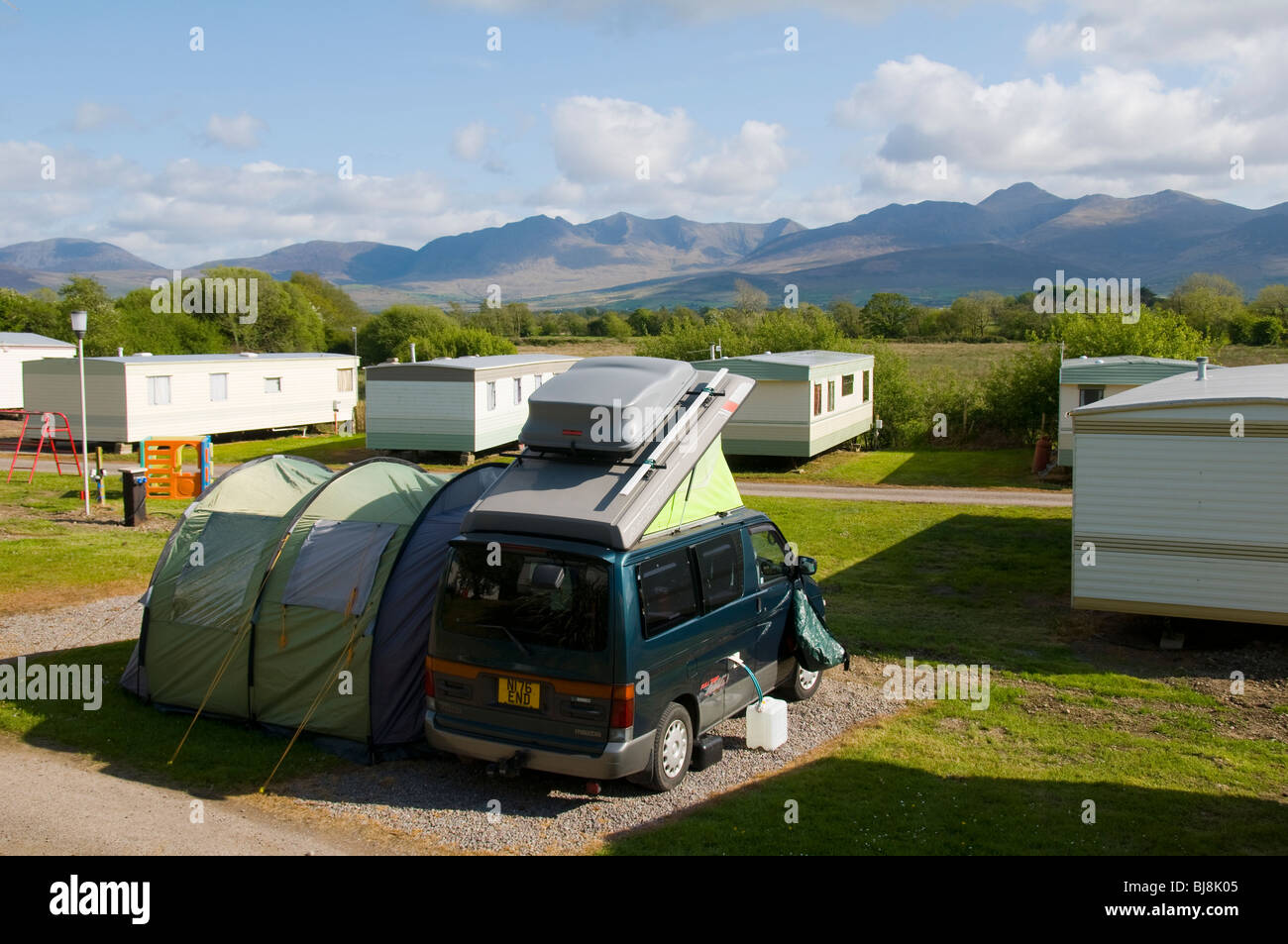 A camp site at Killorglin, Kerry, Ireland, with a view of Carrauntuohil and the MacGillicuddy's Reeks mountain range. Stock Photo