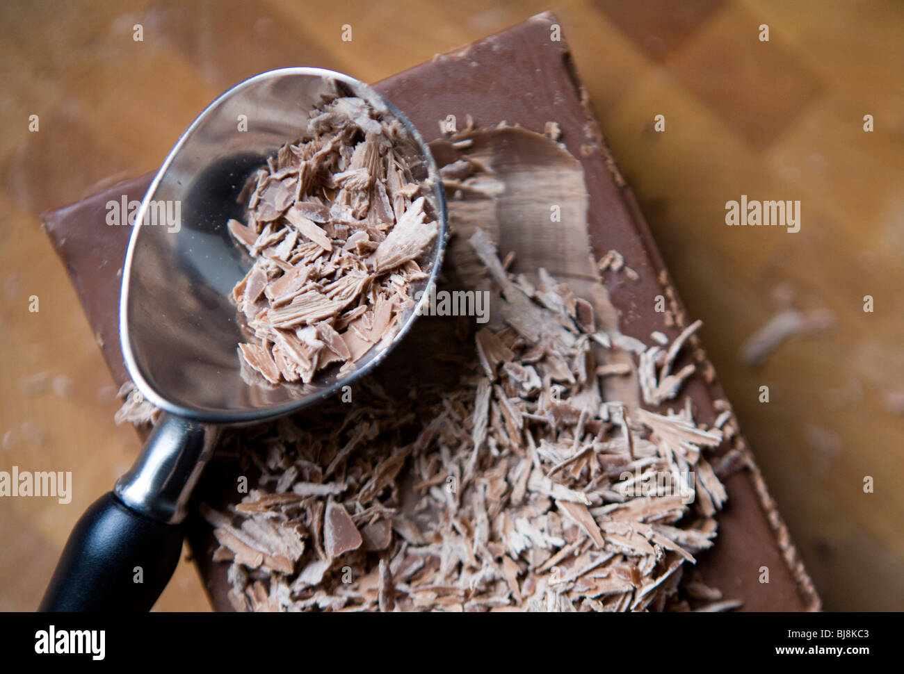 A block of milk chocolate and milk chocolate shavings.  Stock Photo