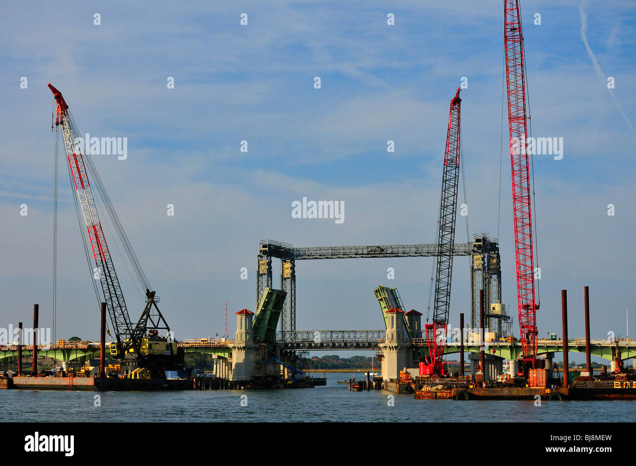 Cranes and other  heavy equipment take part in rehabilitation of the Bridge of Lions Stock Photo