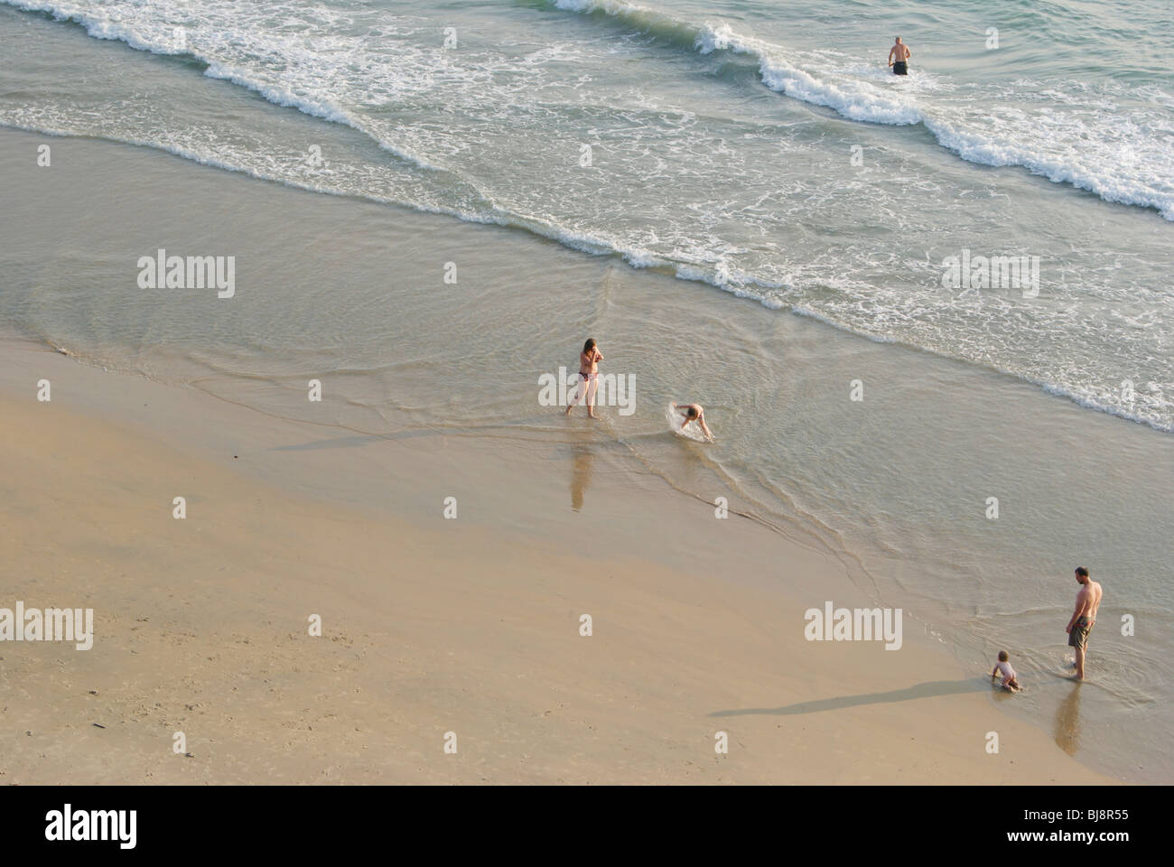 International Tourists enjoying their vacation in Kerala Varkala Beach India Stock Photo