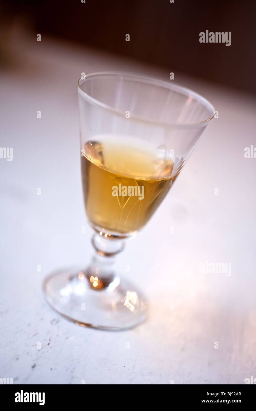 Swedish schnaps in a tiny glass on an old table Stock Photo