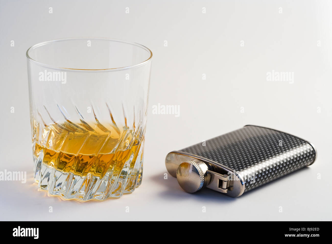 A flask and a glass of whiskey Stock Photo Alamy