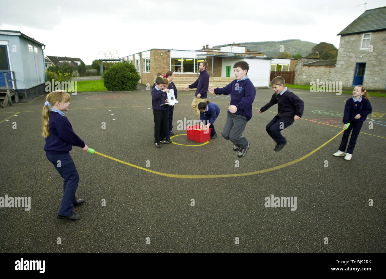 Skipping, traditional playground game being played on the schoolyard of