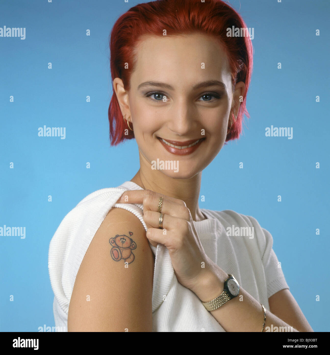 Portrait Teenager With Dyed Hair Girl Showing Cute Tattoo On