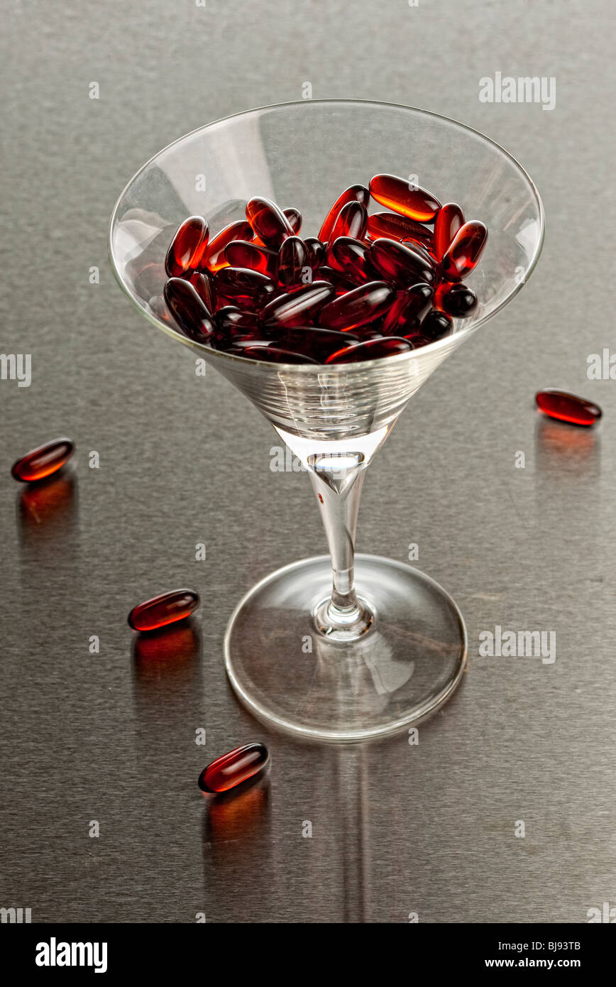 cocktail glass with pills Stock Photo