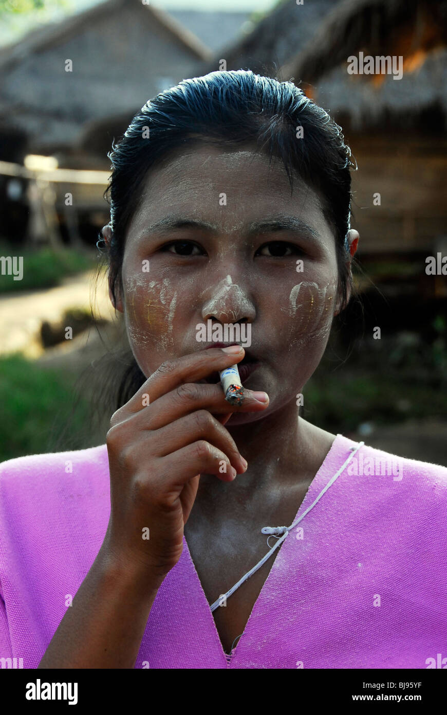karen women smoking weed,umpium refugee camp(thai burmese border) , south of mae sot , tak,thailand Stock Photo
