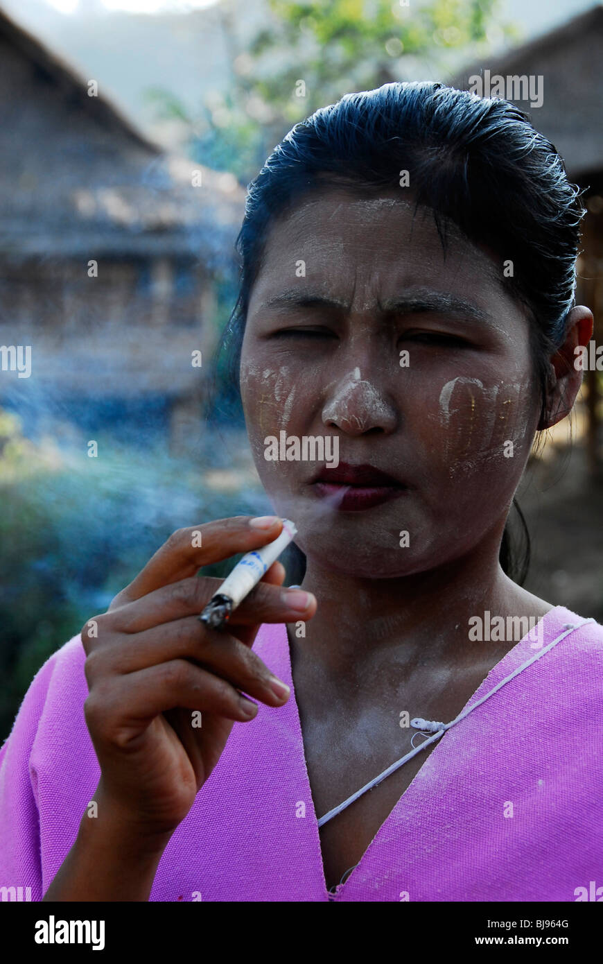 karen women smoking weed, umpium refugee camp(thai burmese border) , south of mae sot , tak,thailand Stock Photo